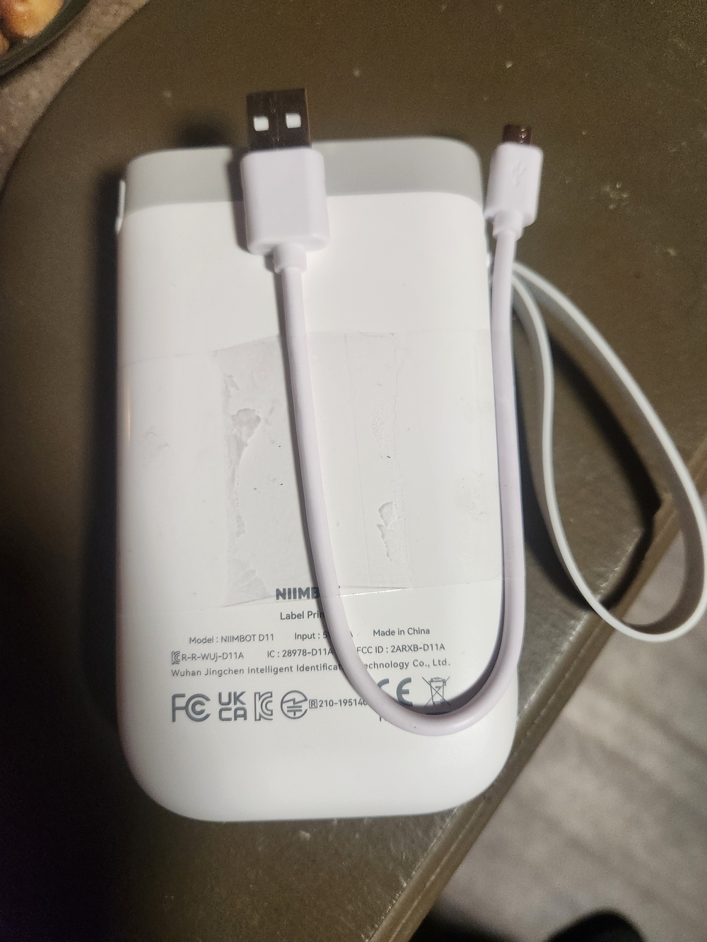 White Portable Power Bank Charger with Integrated USB Cable